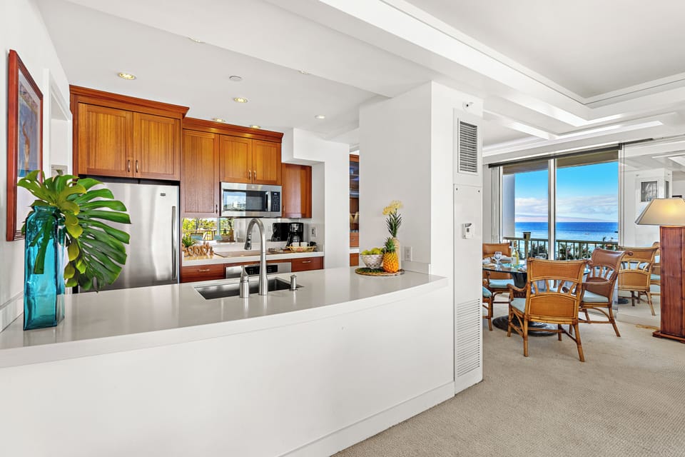 Fully equipped kitchen with a generous breakfast bar, comfortable seating, and modern appliances. Ideal for casual dining or enjoying your morning coffee before a day in paradise
