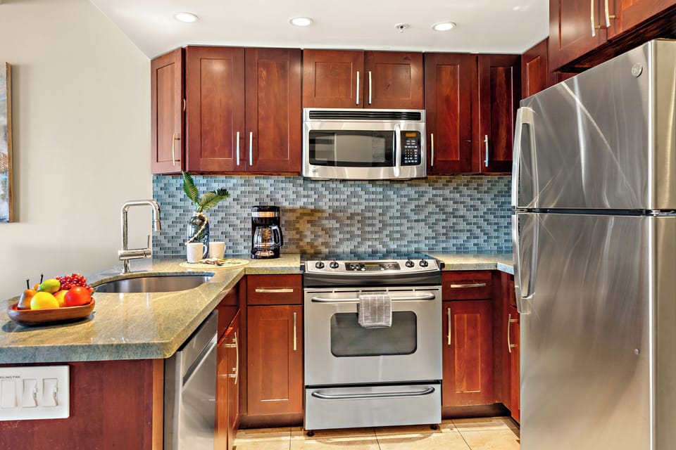 Designed for both convenience and style, this modern kitchen offers everything needed for effortless dining during your Maui getaway.
