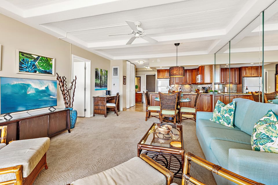 Spacious and beautifully appointed, the open-concept living area offers comfortable seating, elegant island-inspired décor, and seamless access to the private lanai.