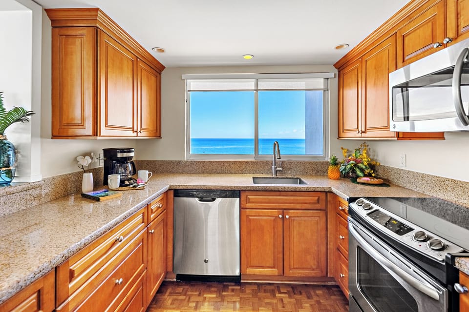 Cook with ease in a thoughtfully designed, fully equipped kitchen. Featuring modern appliances, ample counter space, and all the essentials you need, from quick island breakfasts to full home-cooked dinners.