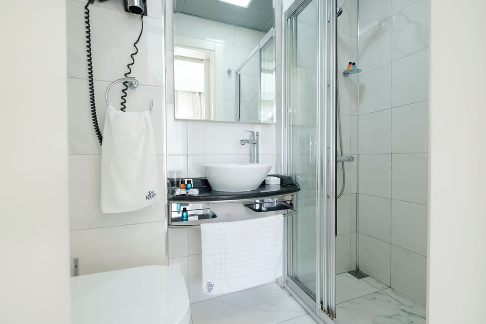 Shower, free toiletries, hair dryer, slippers