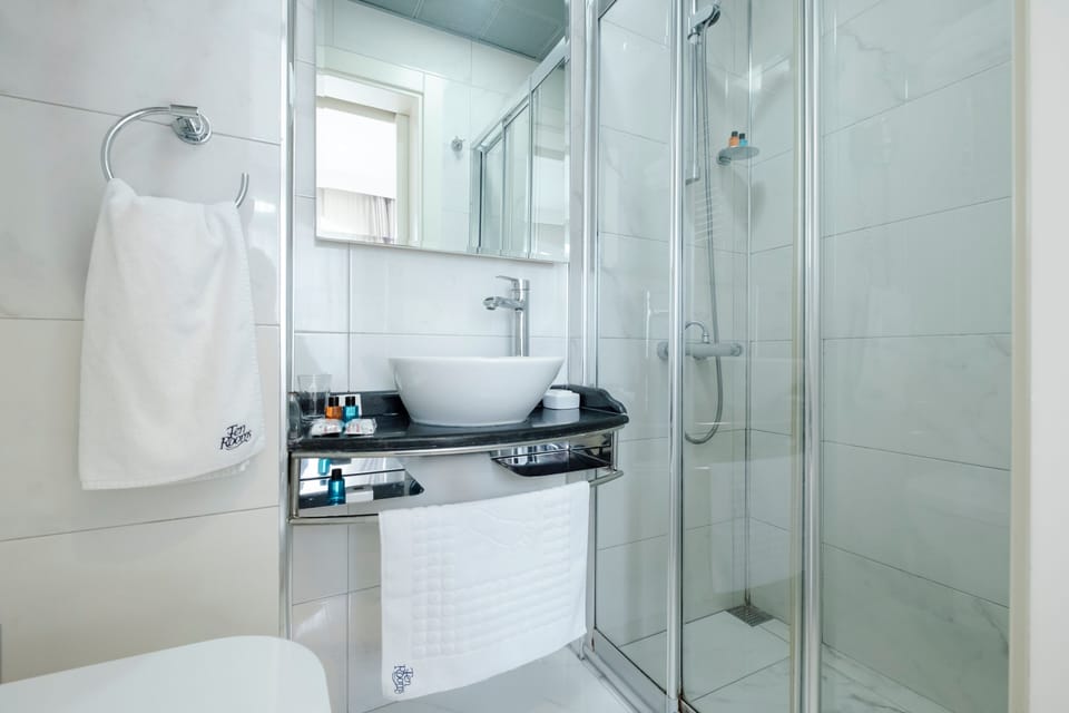 Shower, free toiletries, hair dryer, slippers