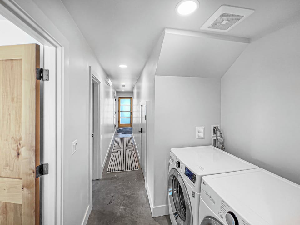 Full washer and dryer access in hallway. 