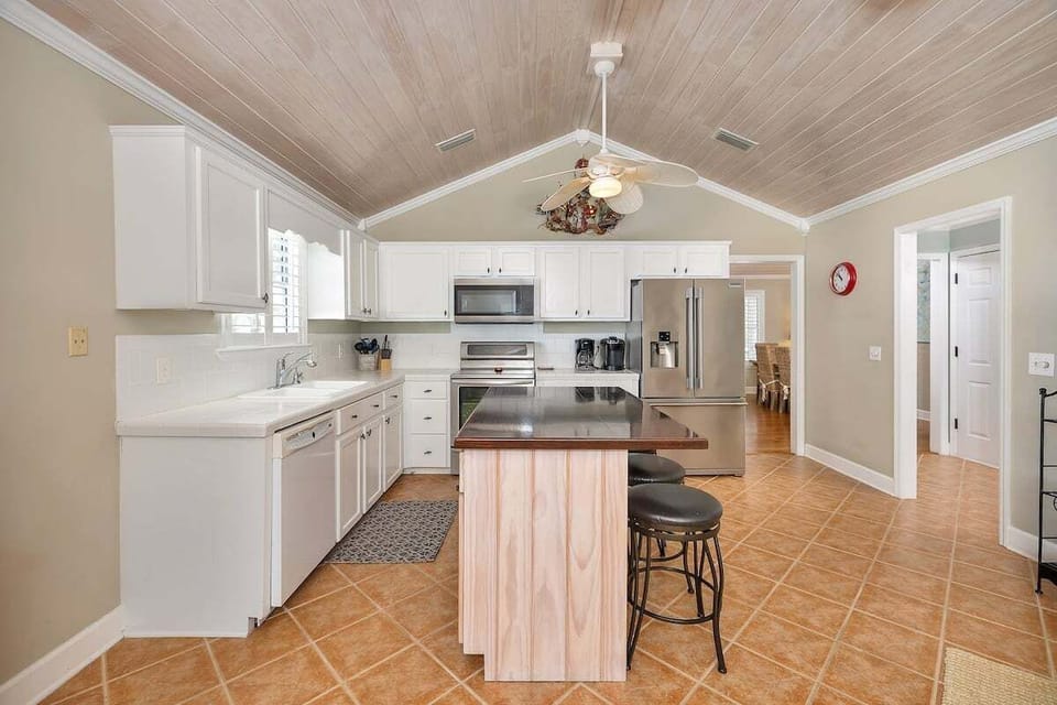 Kitchen with white cabinets and island