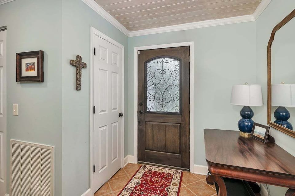 Entryway with console table and front door