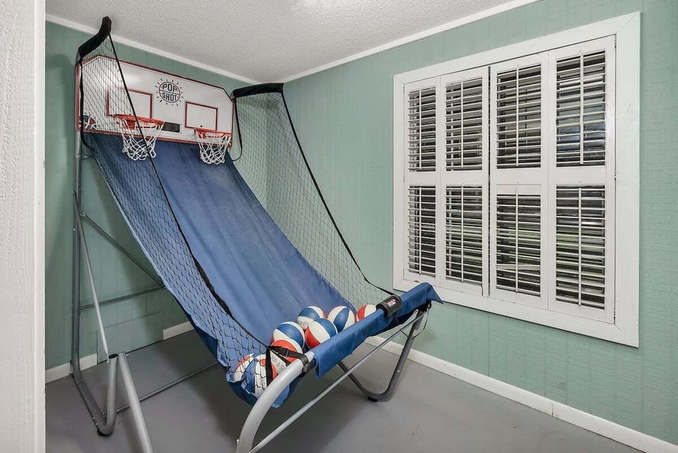 Game room with arcade basketball game