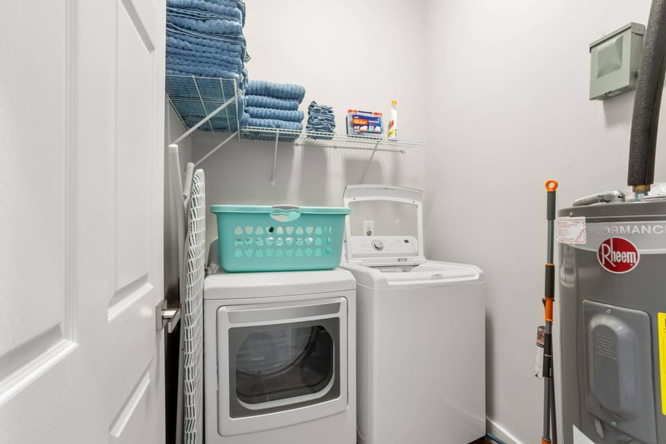 Laundry Room, has iron & iron board, step stool and vacuum