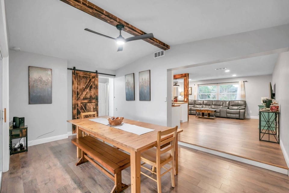 Large Dining Room with Natural Wood Table and Seating for 6-8