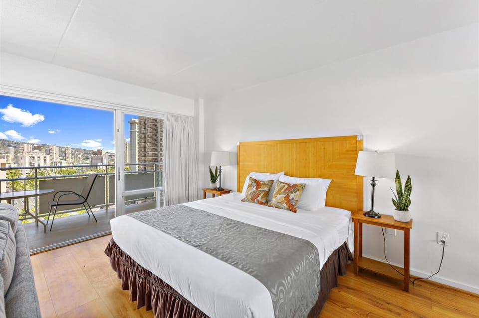 King bed with panoramic city and mountain  views