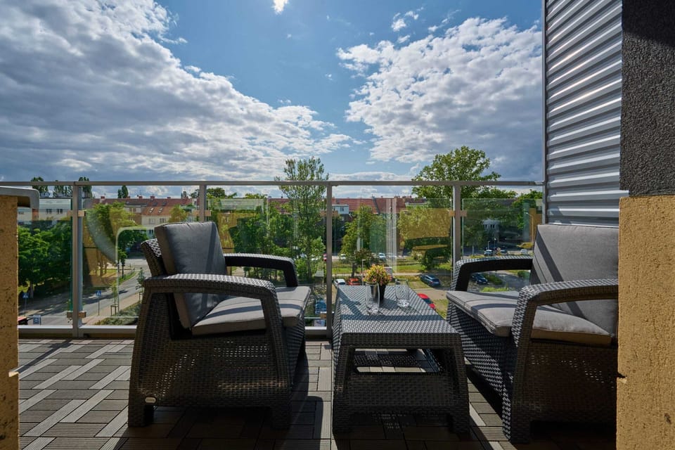 Relax on the balcony's comfortable chairs and enjoy the fresh air.