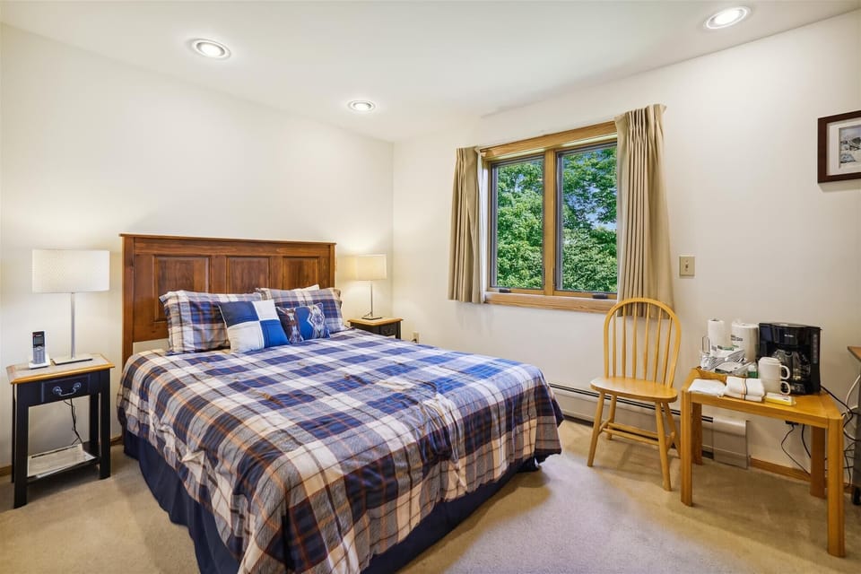 Queen sized bed, access to small deck.  Small amenities for your convenience, coffee pot and TV