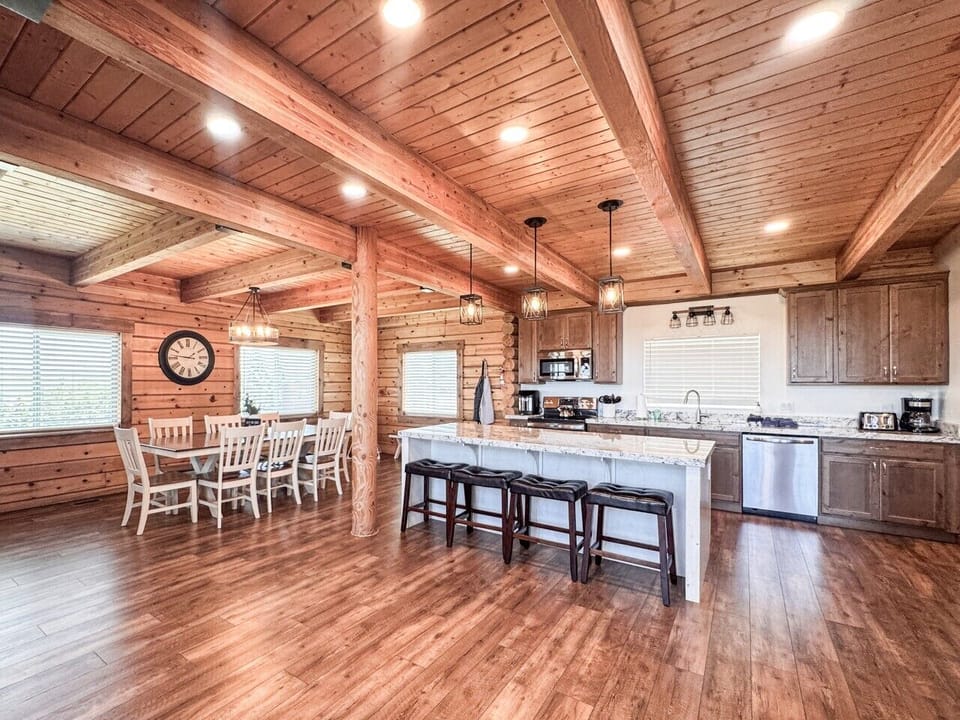 Rustic elegance meets modern comfort in this spacious gathering spaces and kitchen.