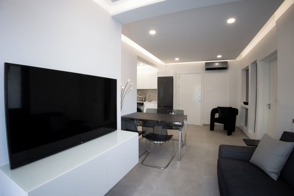 Luxury Apartment | Living area | 43-inch Smart TV with cable channels