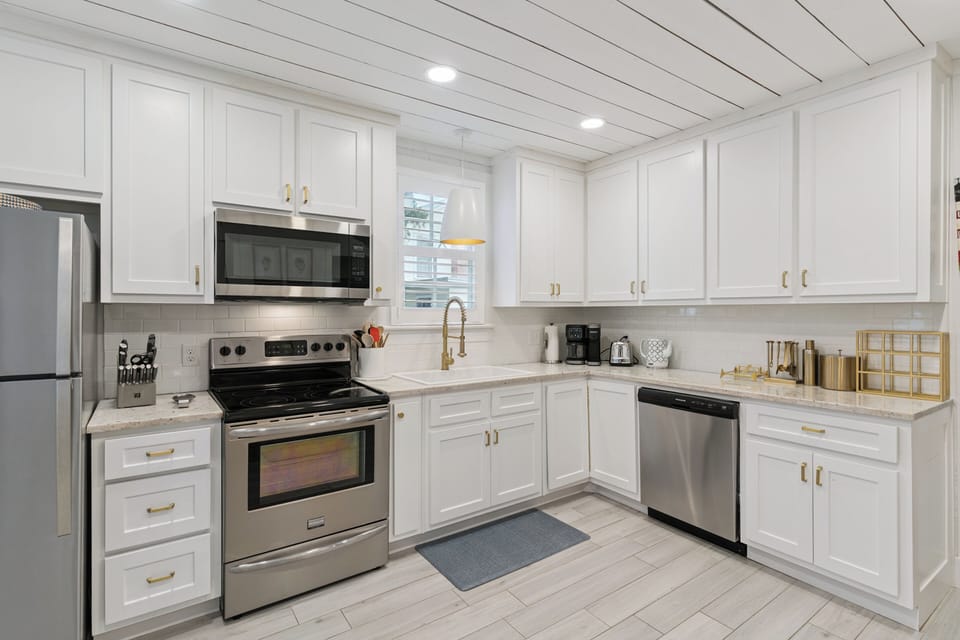 This elegant, fully-equipped kitchen offers everything you need to prepare delicious meals. Bright white cabinetry, modern appliances, and plenty of counter space make cooking a pleasure during your stay.