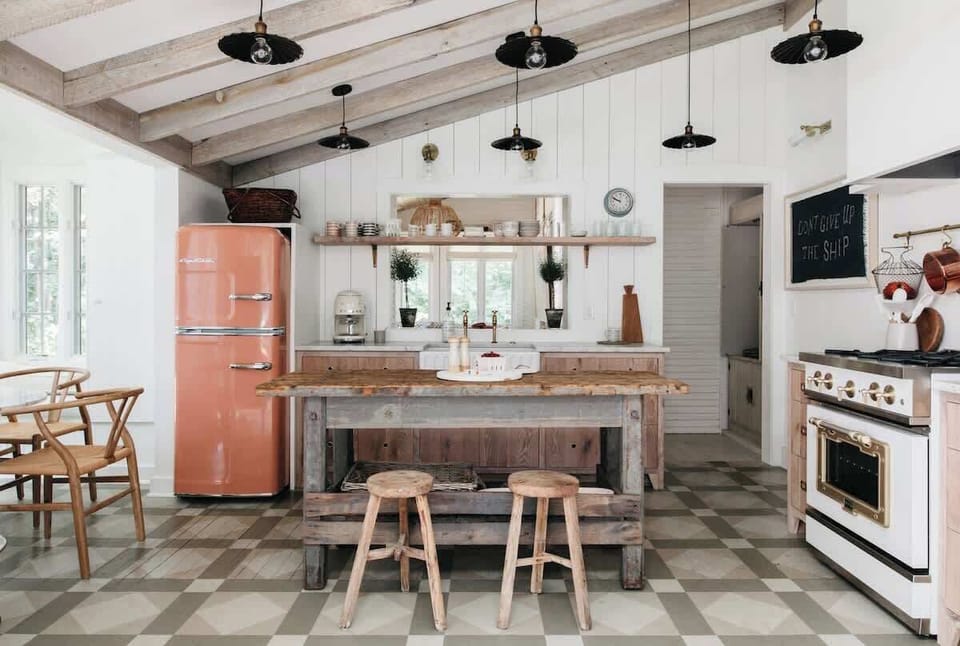 The kitchen has been updated to include many modern amenities while still retaining a vintage lake house feel.