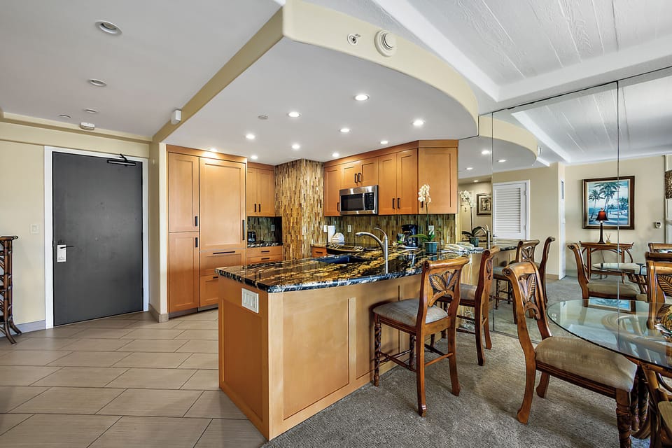 Gather around the large granite island or dine in comfort—this open kitchen and dining space offers everything you need to cook, share meals, and relax together.