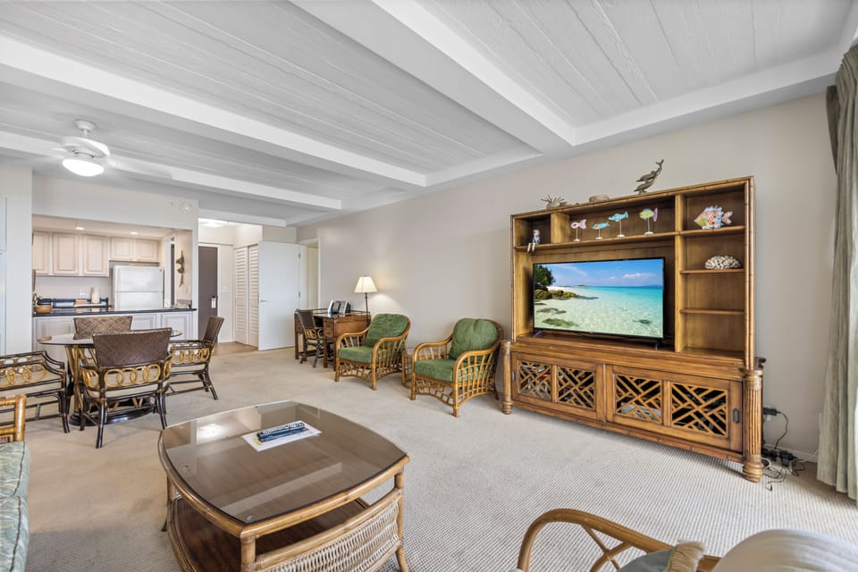 Settle into your spacious living room where island-inspired furniture and warm wood tones create a welcoming retreat. Enjoy your favorite shows or simply relax in comfort after a day of adventure.
