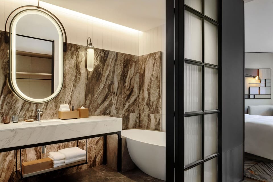 Separate tub and shower, rainfall showerhead, free toiletries
