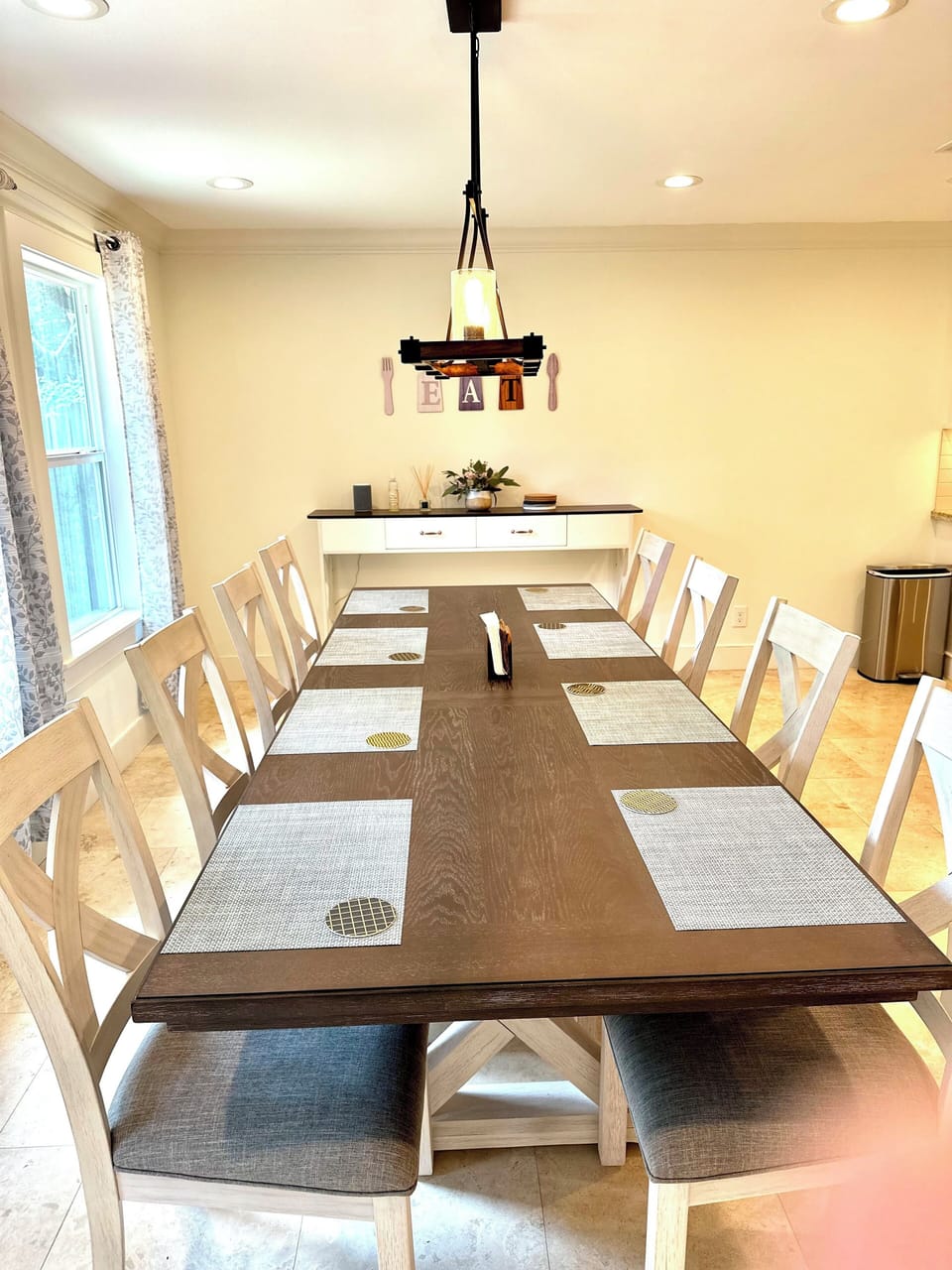 Dining table seats 8-10 people comfortably. 2 extra chairs in bedrooms.