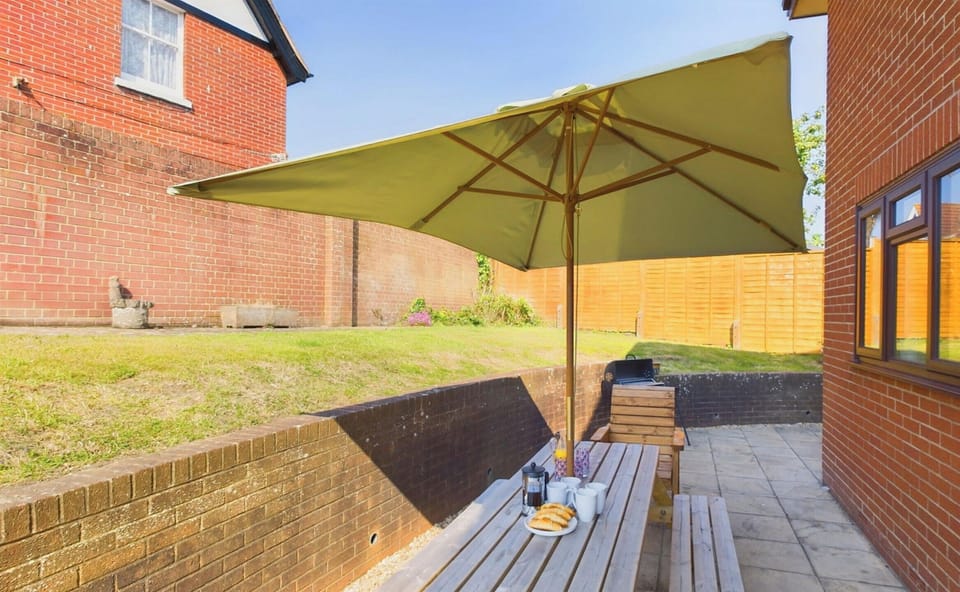 Garden with patio and outdoor dining and BBQ.