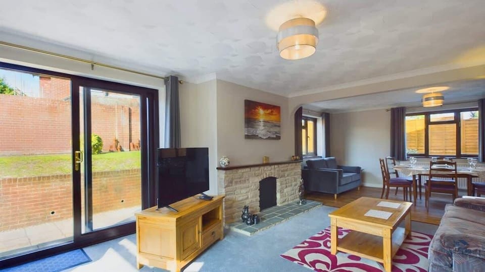 The main lounge offers a cozy retreat with plush sofas and a traditional fireplace.