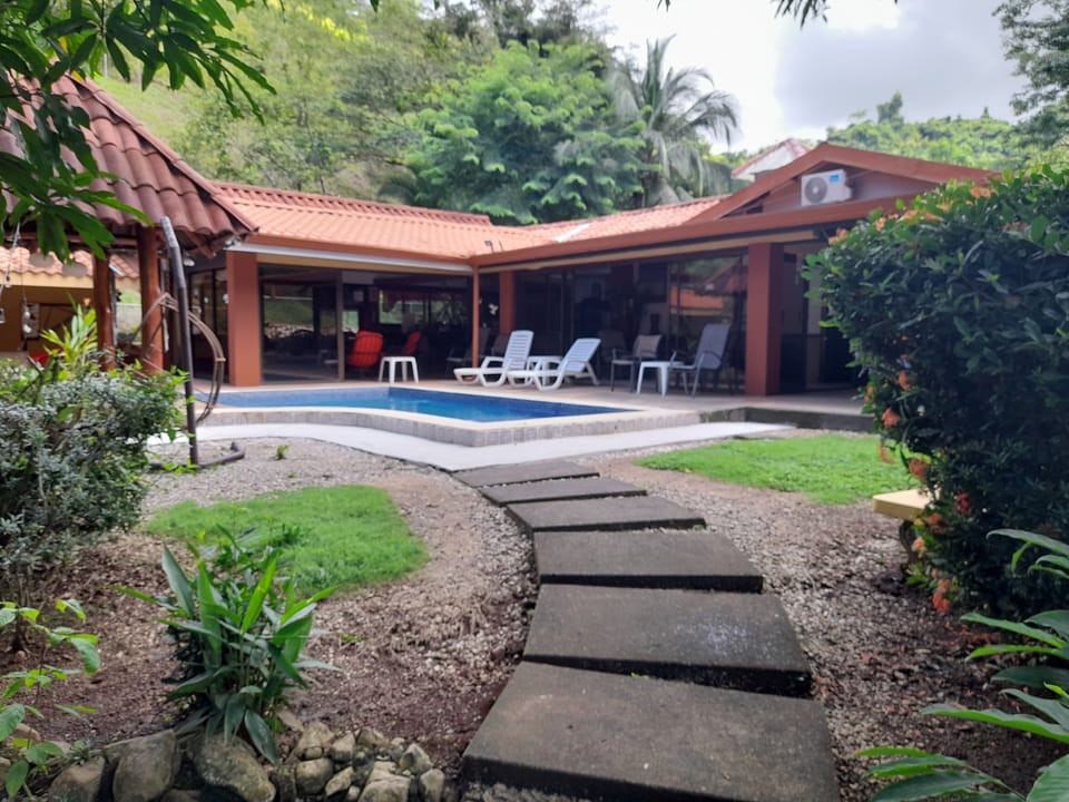 Walkway from Casita #1 and #2 to our main house through tropical fauna!