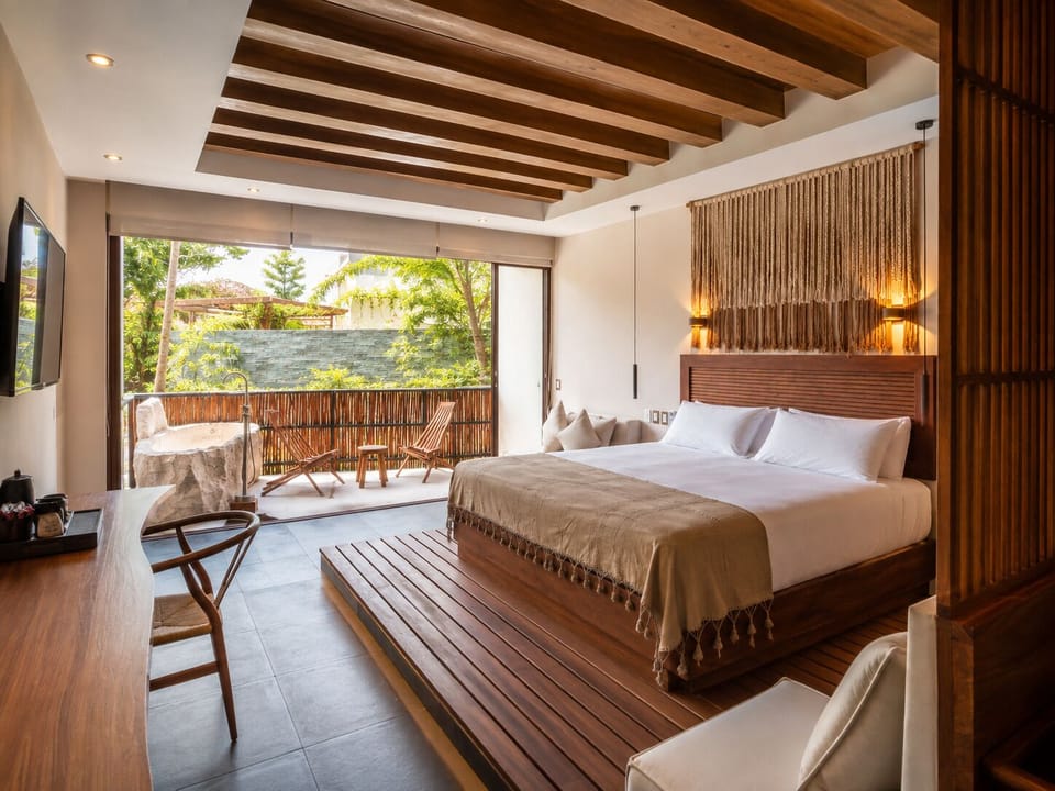 King suite with private terrace and seamless indoor-outdoor living.