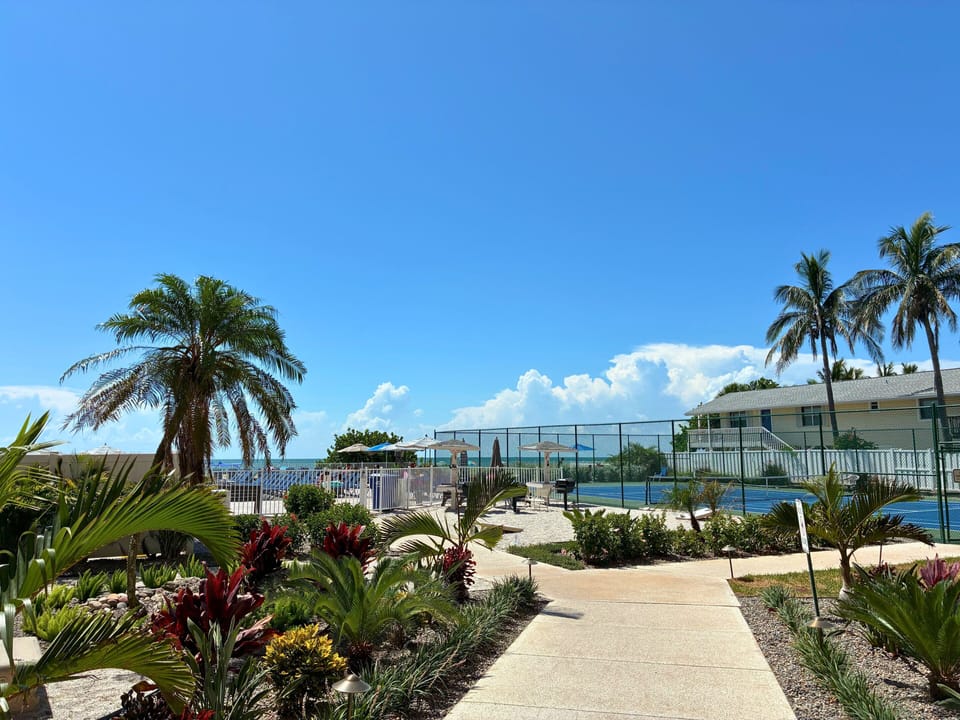 Amenities galore! Pool with sundeck, hot tub, tennis/pickleball courts, Grills, Cornhole.