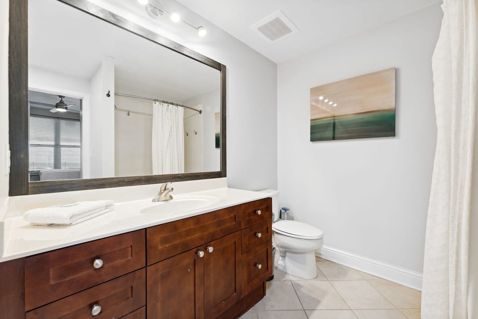 Clean, updated bathrooms with bright finishes.