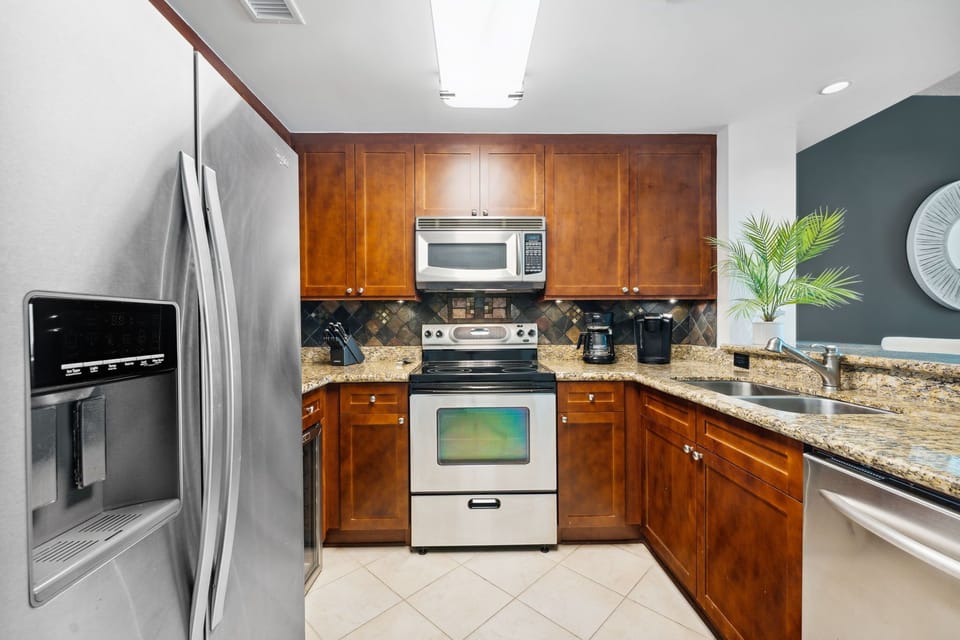 Bright, modern kitchen fully stocked for vacation cooking.