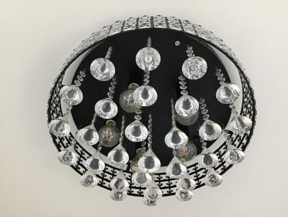 Primary en-suite chandelier.