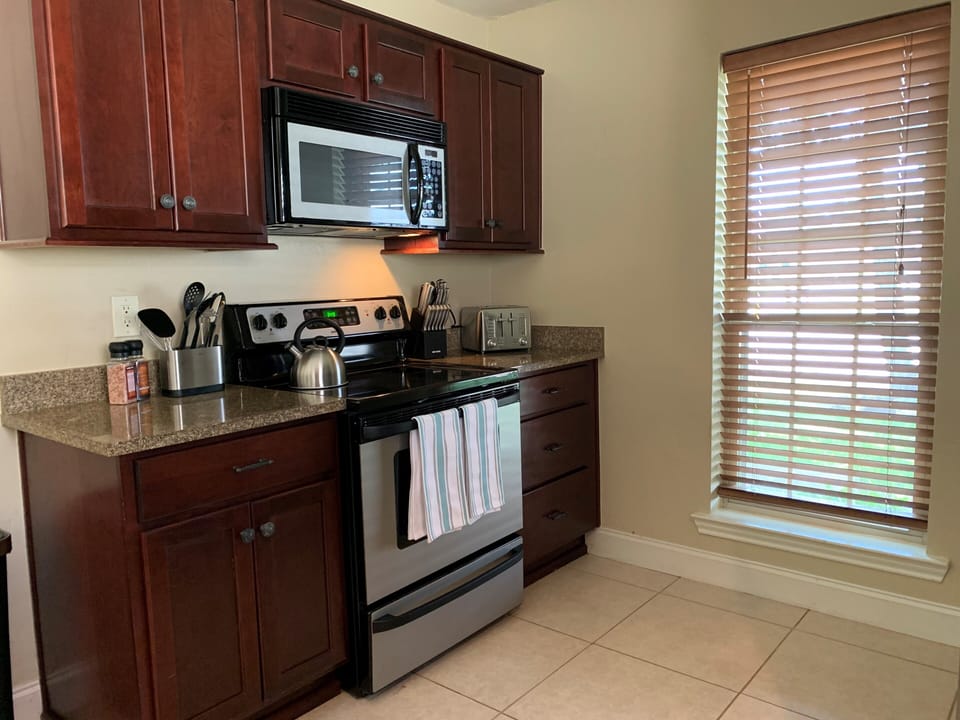 Spacious Kitchen With Electric Oven, Range, Microwave and Dishwasher
