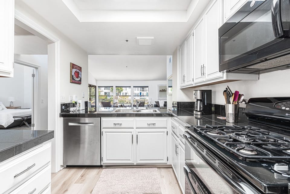 The cook's view out to the living, dining and patio areas.
                