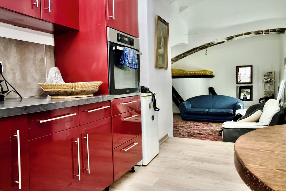 Fully equipped kitchen with crockery and utensils.
