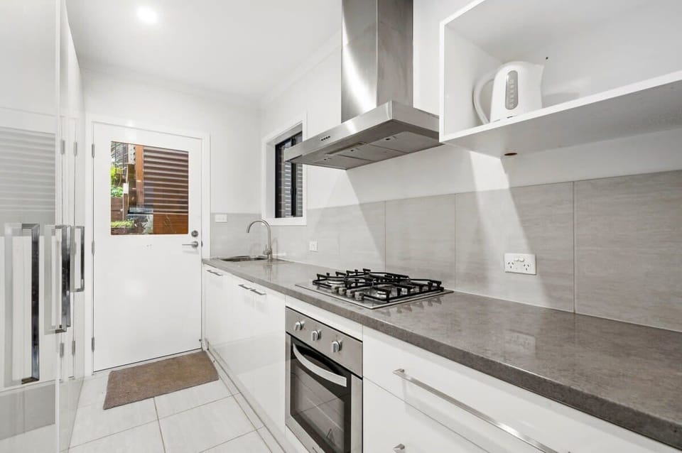 Semi self-contained ground floor layout features a living zone and European laundry with kitchenette (oven and gas stove)