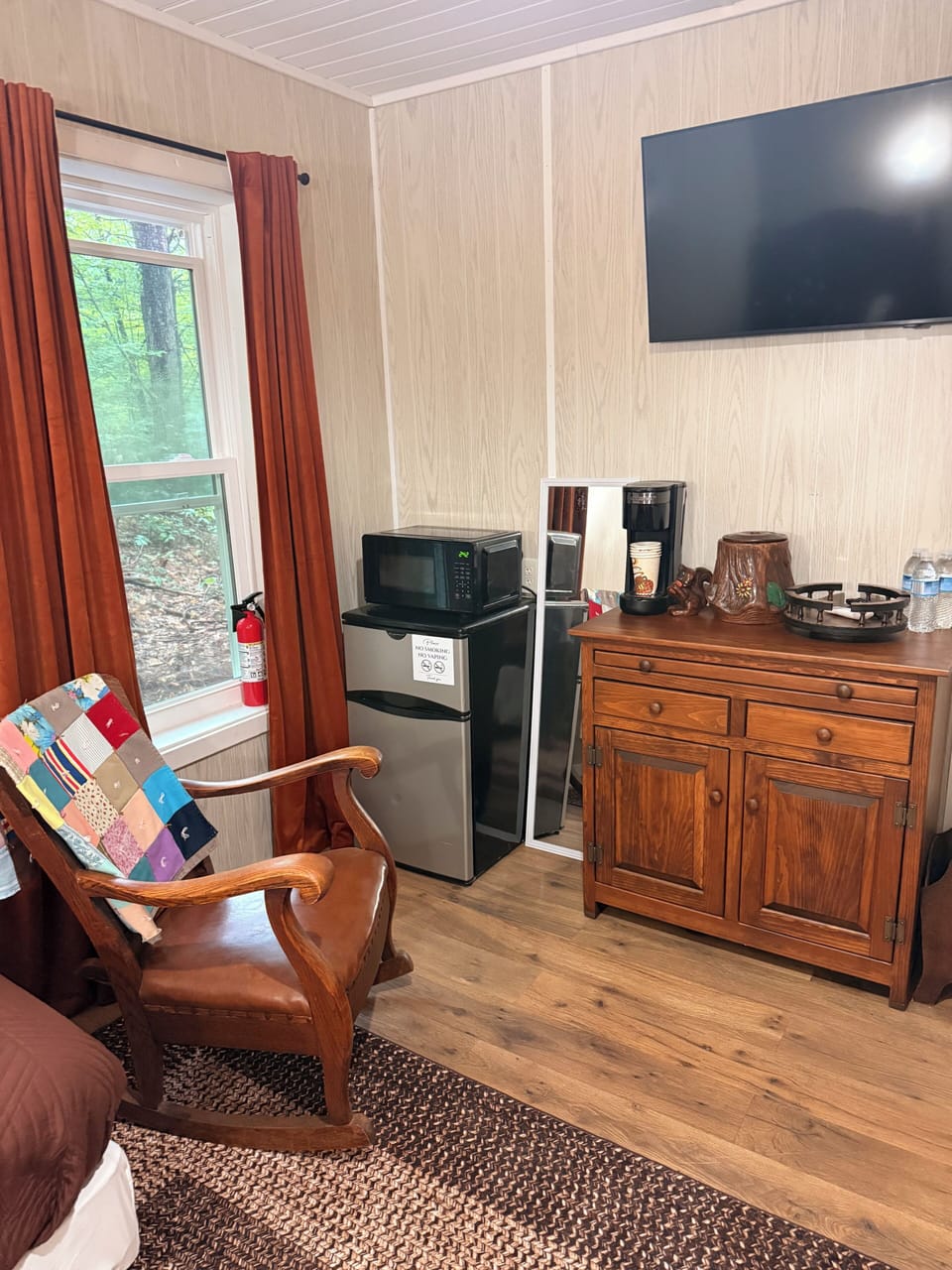 Jean's side has a coffee bar, mini fridge and TV