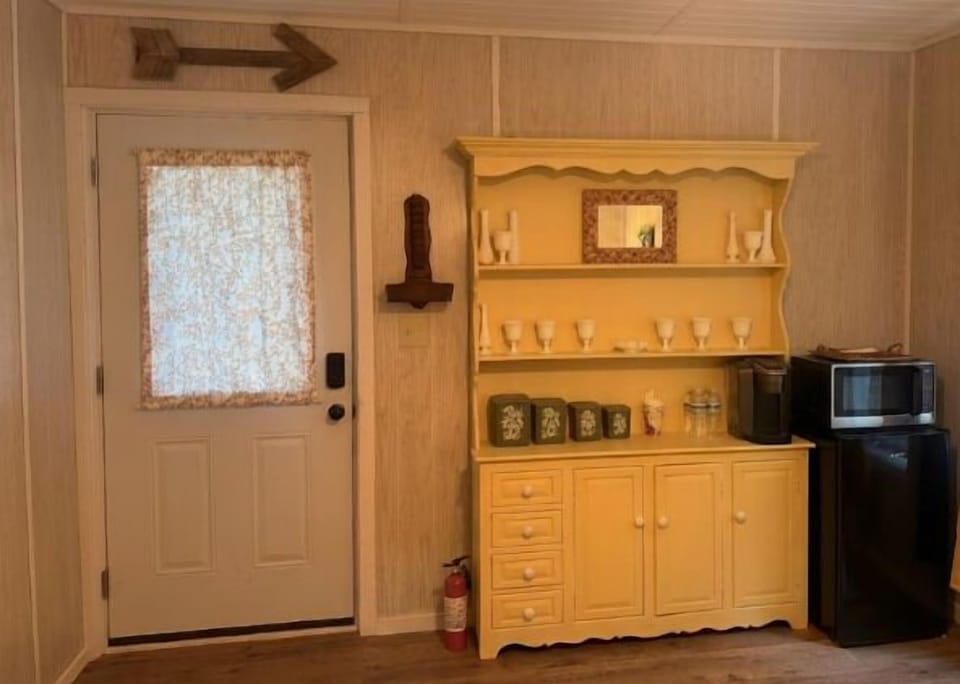 Lise' side has a coffee bar and mini fridge
