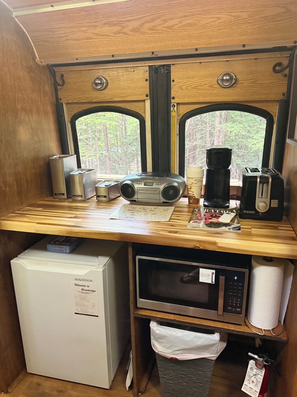 CD player, coffee maker, toaster, microwave and mini fridge.