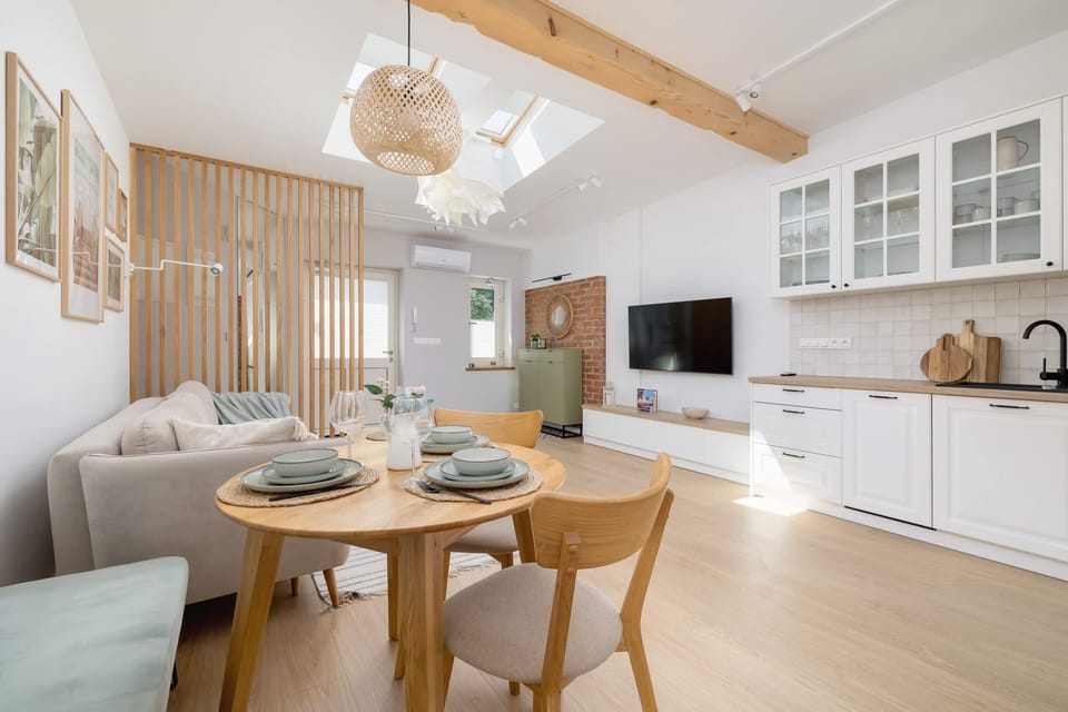 The elegant living room featuring a double sofa bed, perfect for relaxing or sleeping.