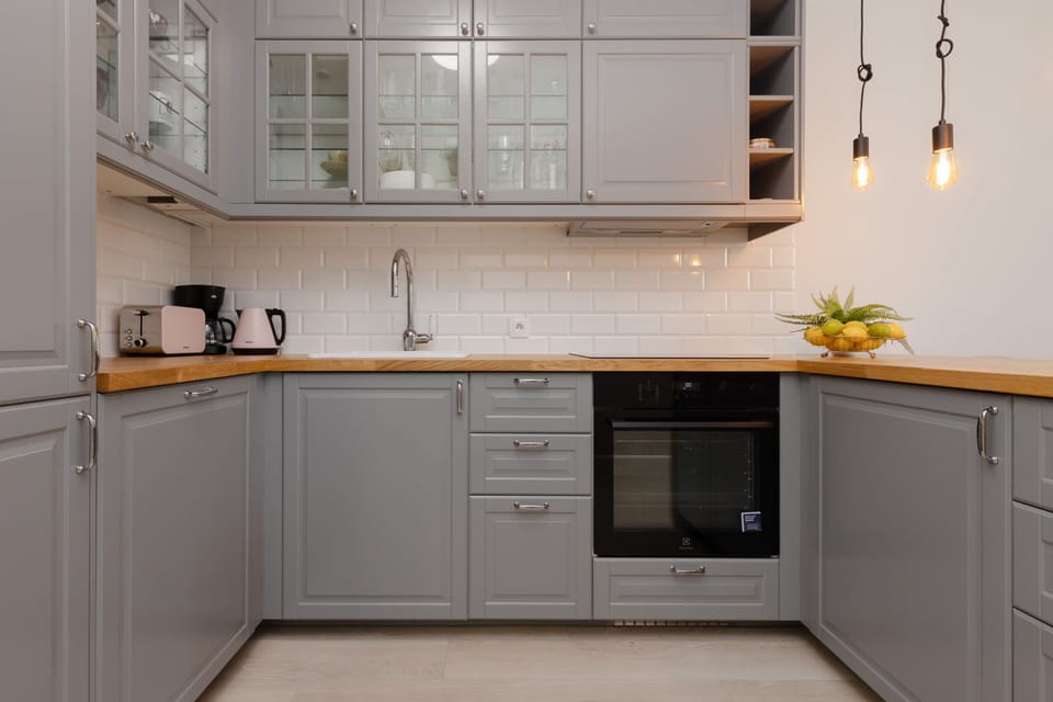 The sleek design of the kitchenette blending seamlessly with the living area.