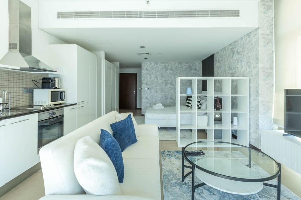 Deluxe Studio | Living area | 50-inch Smart TV with cable channels, Netflix, streaming services