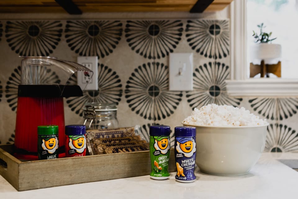 Popcorn bar includes airpop popcorn or micrwave and a variety of seasonings.