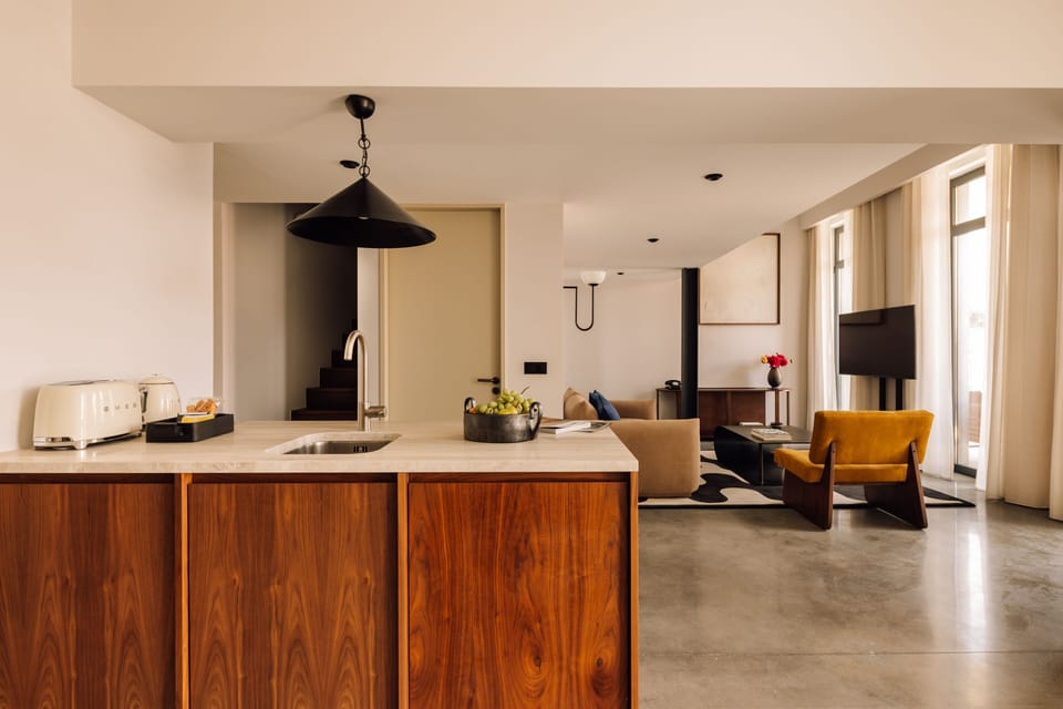 Two Bedroom Duplex River View | Living area | 50-inch flat-screen TV with cable channels