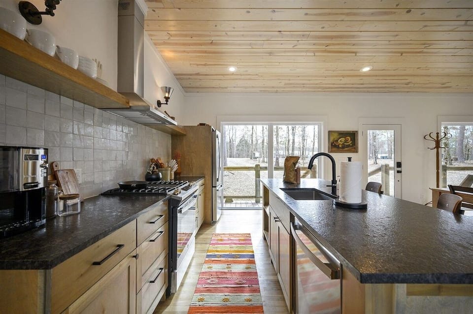 Chef's Kitchen: Cook up a feast with modern appliances and a stunning view of nature!