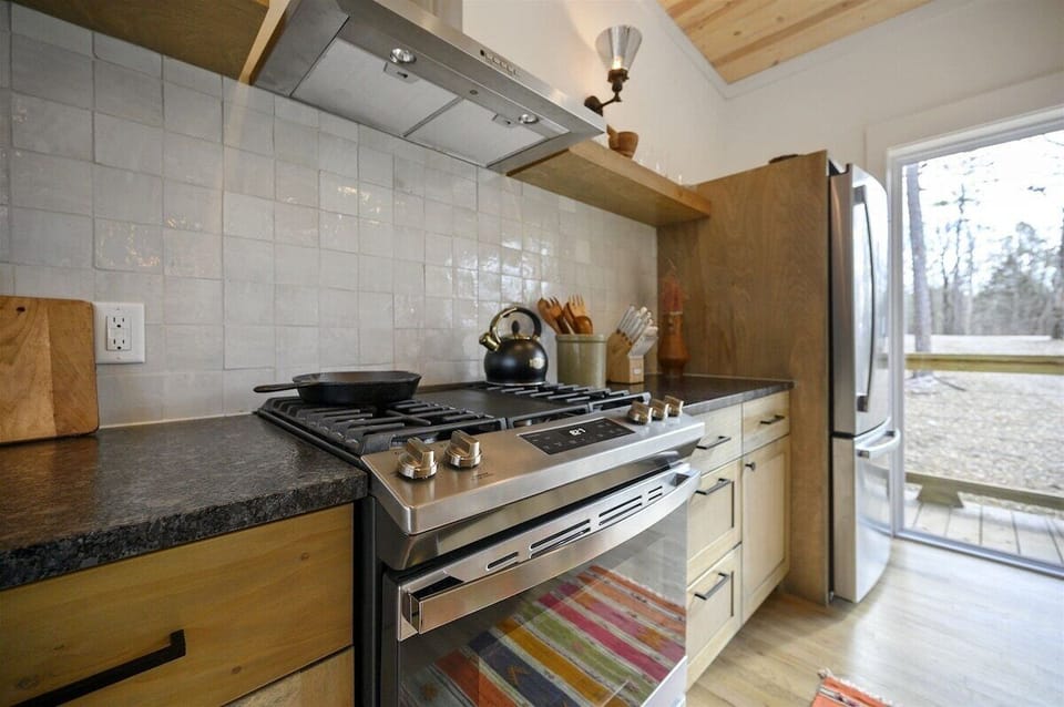 Gourmet Kitchen: Cook up a feast with modern appliances and bright, inviting views of nature!