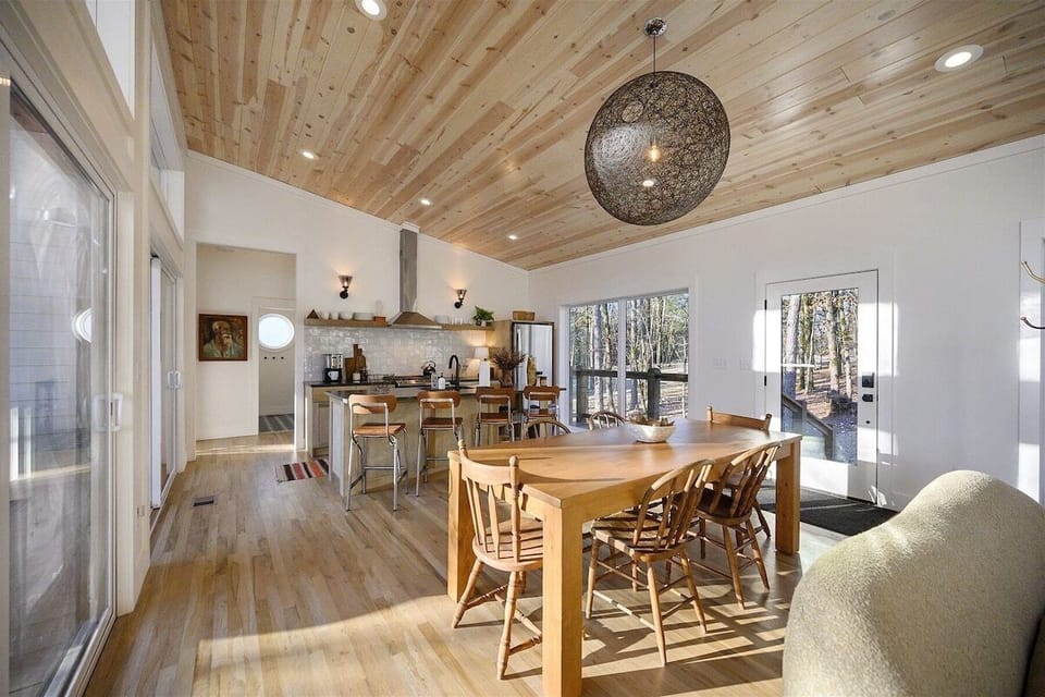Dining Room: Gather round the stunning wood table and enjoy delicious meals with nature's view!