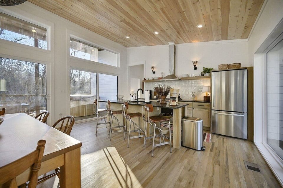 Kitchen: Modern amenities and sunlight invite culinary adventures and laughter with friends!