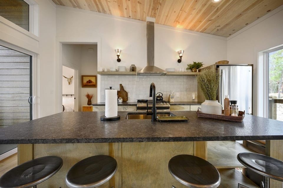 Kitchen: Culinary adventures await in this stylish space with modern appliances and chic decor!