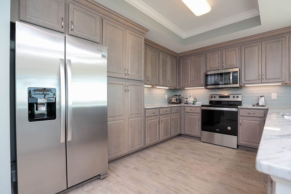 Condo, 4 Bedrooms | Private kitchen | Coffee/tea maker, fridge, oven