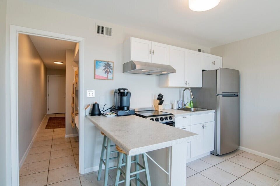 Savor the perfect blend of function and style in this modern condo kitchen